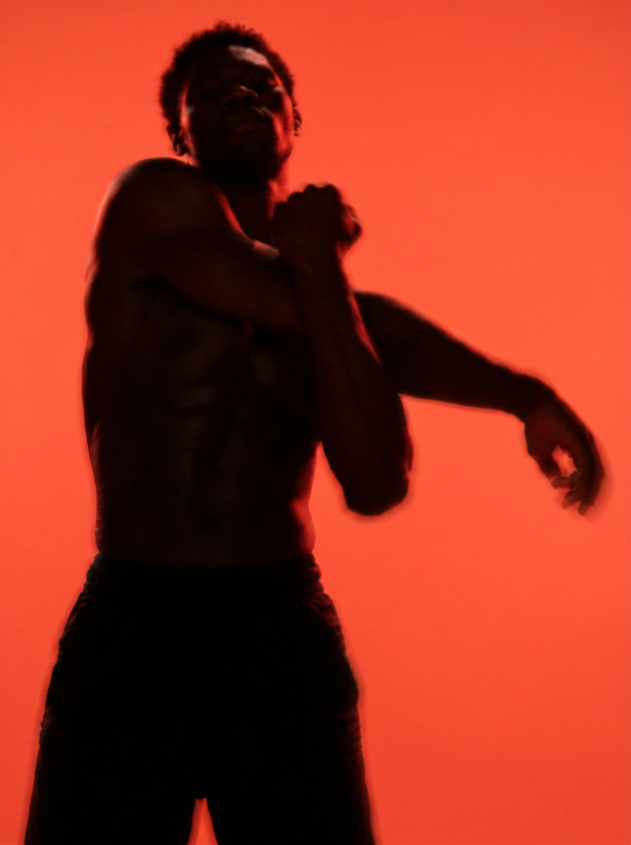 Athlete silhouette bathed in red light